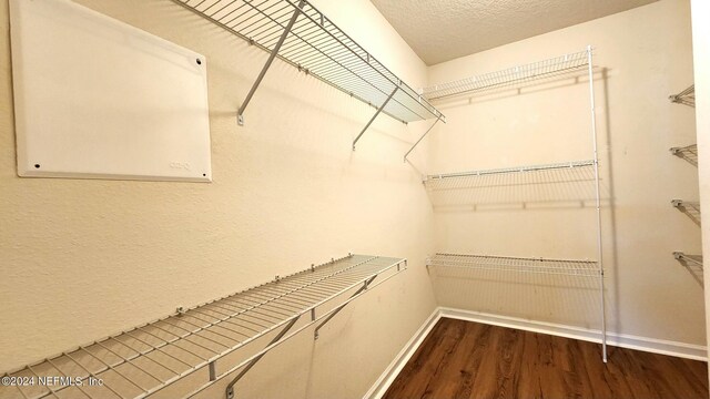 11775 Blueberry Ln, Macclenny, FL 32063 - spacious closet featuring dark wood-style flooring