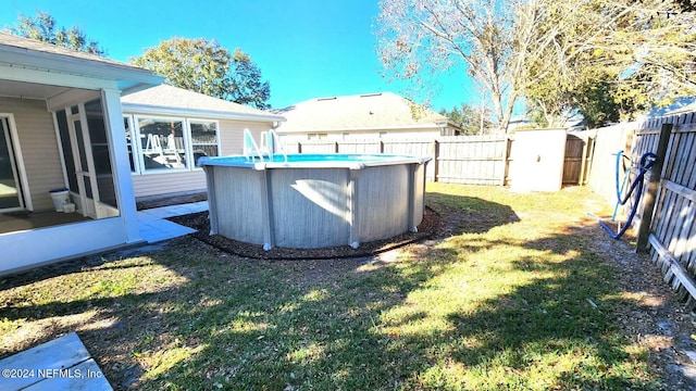 11775 Blueberry Ln, Macclenny, FL 32063 - view of yard featuring a fenced in pool, a fenced backyard, and a sunroom