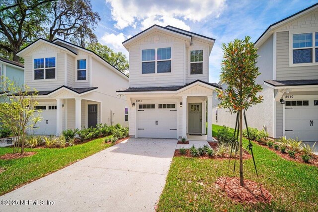 8922 Free Ave, Jacksonville, FL 32211 - view of front facade featuring a garage and concrete driveway