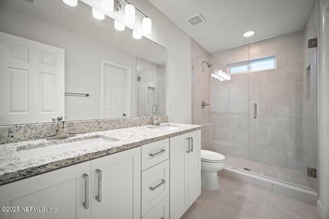 8922 Free Ave, Jacksonville, FL 32211 - full bathroom featuring double vanity, visible vents, a sink, and a stall shower