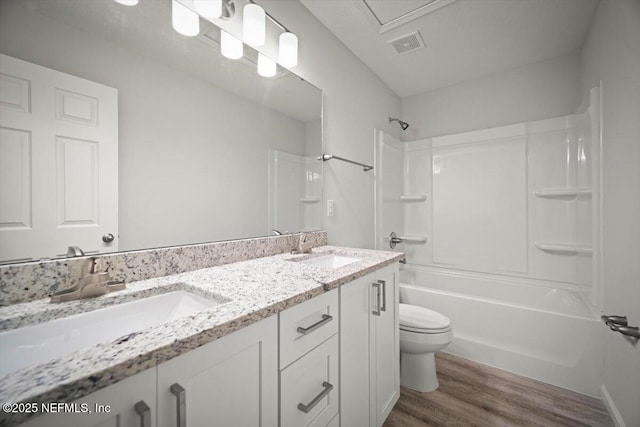 8922 Free Ave, Jacksonville, FL 32211 - full bath featuring a sink, visible vents, toilet, and wood finished floors