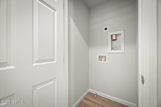 8922 Free Ave, Jacksonville, FL 32211 - laundry room featuring hookup for an electric dryer, baseboards, washer hookup, laundry area, and wood finished floors
