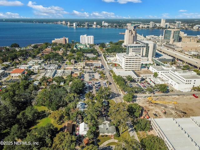 birds eye view of property with a water view and a view of city