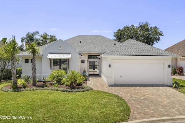 1592 Harbour Club Dr, Ponte Vedra Beach, FL 32082 - view of front facade featuring an attached garage, stucco siding, a shingled roof, and a front lawn