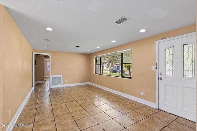 4263 Springwood Rd, Jacksonville, FL 32207 - entrance foyer featuring light tile patterned flooring, baseboards, visible vents, and recessed lighting