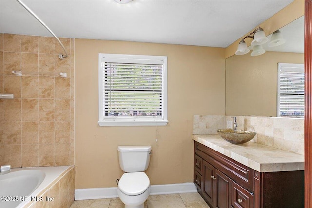 4263 Springwood Rd, Jacksonville, FL 32207 - bathroom with toilet, tile patterned floors, plenty of natural light, and vanity