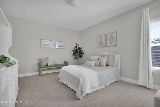 carpeted bedroom with baseboards