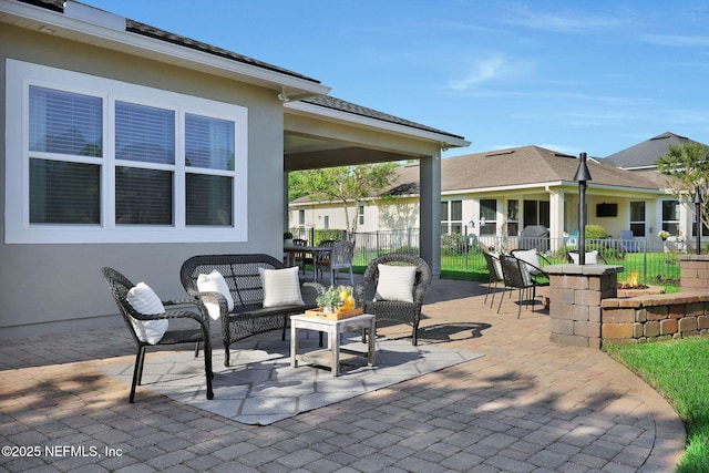 view of patio / terrace with an outdoor living space and fence