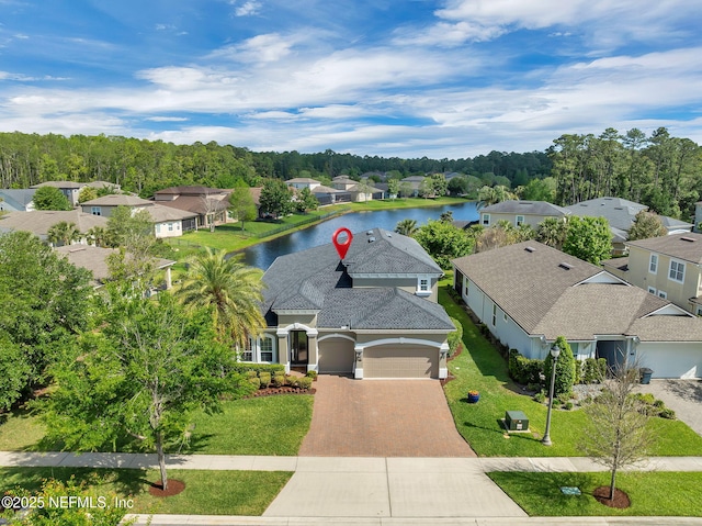 drone / aerial view with a residential view and a water view