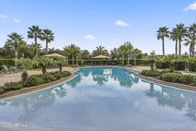 community pool with a patio area