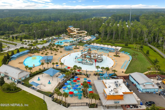 bird's eye view featuring a wooded view