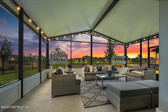 sunroom / solarium with a water view and an outdoor hangout area