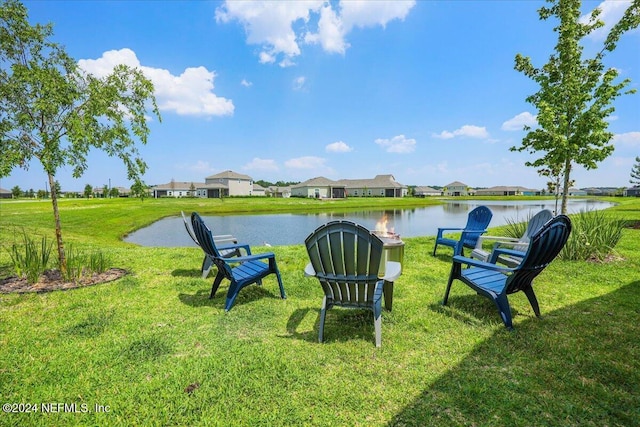 view of yard featuring a water view and a residential view
