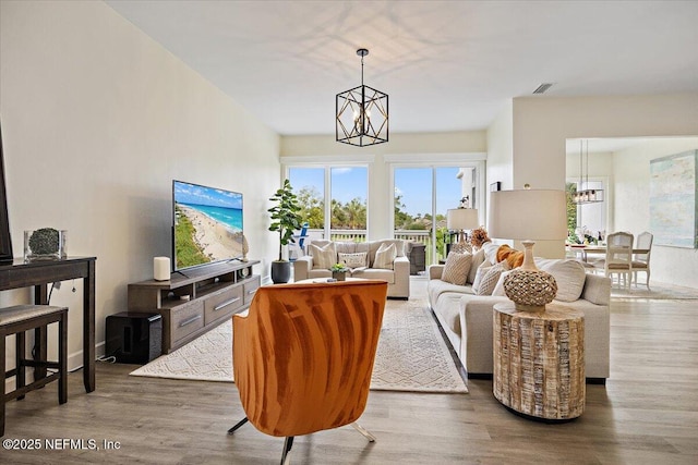 58 Tifton Way N, Ponte Vedra Beach, FL 32082 - living area featuring a chandelier and wood finished floors