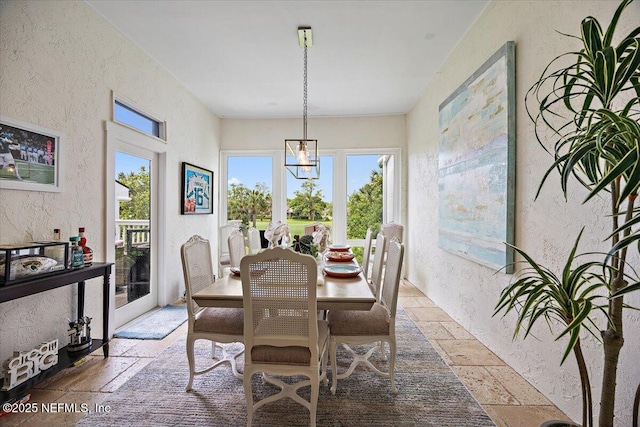 58 Tifton Way N, Ponte Vedra Beach, FL 32082 - dining area with stone tile floors and a textured wall