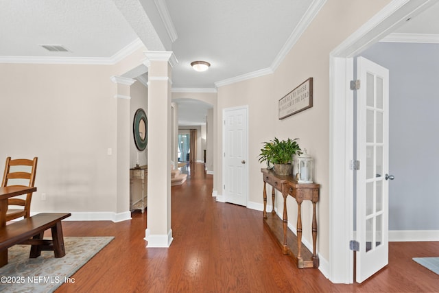 243 Olivette St, Saint Johns, FL 32259 - hall with ornate columns, arched walkways, visible vents, wood finished floors, and baseboards