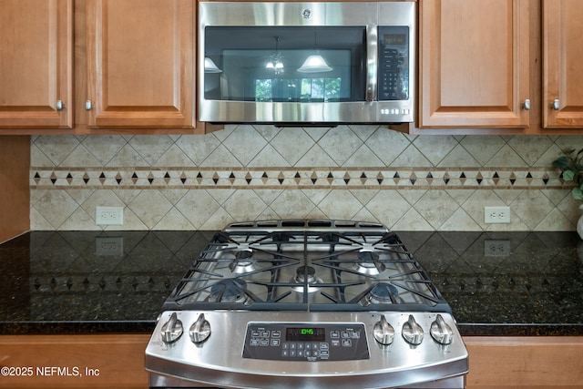 243 Olivette St, Saint Johns, FL 32259 - kitchen with stainless steel appliances, backsplash, and tile counters