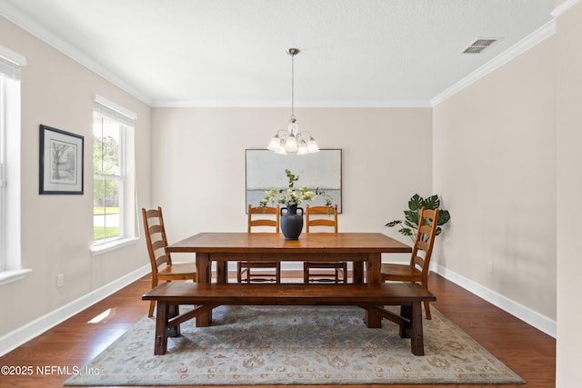 243 Olivette St, Saint Johns, FL 32259 - dining space with visible vents, baseboards, crown molding, and dark wood finished floors