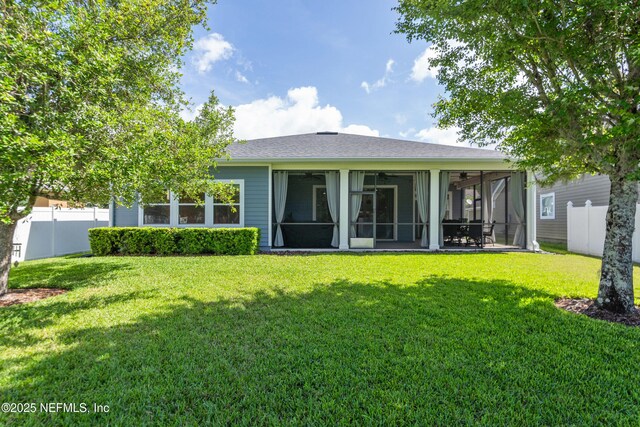 243 Olivette St, Saint Johns, FL 32259 - rear view of property with a yard, roof with shingles, a fenced backyard, and a sunroom