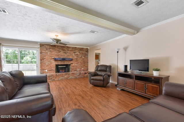 10870 High Ridge Rd, Jacksonville, FL 32225 - living area featuring visible vents, a textured ceiling, a ceiling fan, and wood finished floors