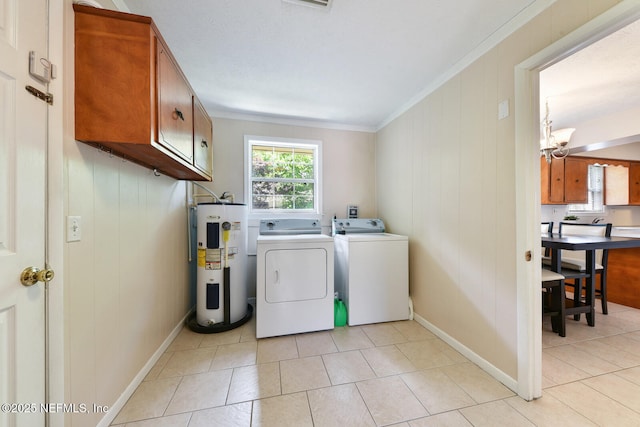 10870 High Ridge Rd, Jacksonville, FL 32225 - laundry room featuring light tile patterned floors, ornamental molding, independent washer and dryer, water heater, and cabinet space