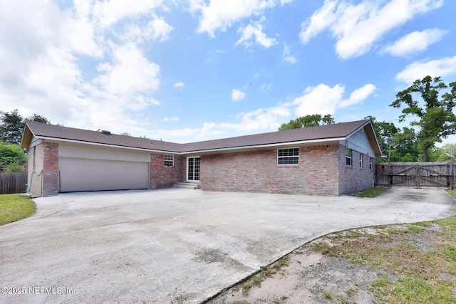 10870 High Ridge Rd, Jacksonville, FL 32225 - single story home featuring driveway, brick siding, entry steps, a garage, and a gate