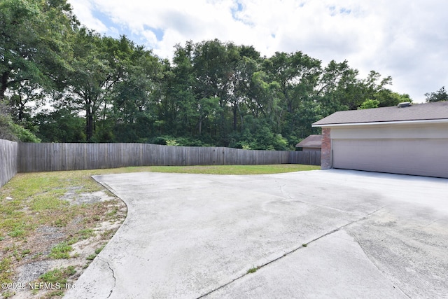 10870 High Ridge Rd, Jacksonville, FL 32225 - view of patio featuring fence and driveway