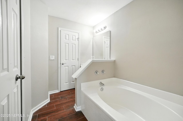 117 Sterling Hill Dr, Jacksonville, FL 32225 - bathroom with a garden tub, baseboards, and wood finish floors