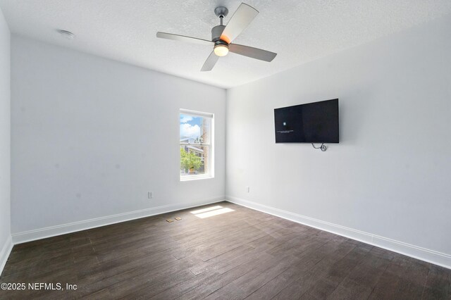 890 Beach Ave, Atlantic Beach, FL 32233 - empty room featuring dark wood-type flooring, a textured ceiling, baseboards, and ceiling fan