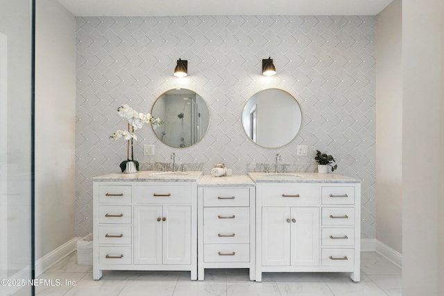 890 Beach Ave, Atlantic Beach, FL 32233 - bathroom with a shower, double vanity, marble finish floor, and a sink