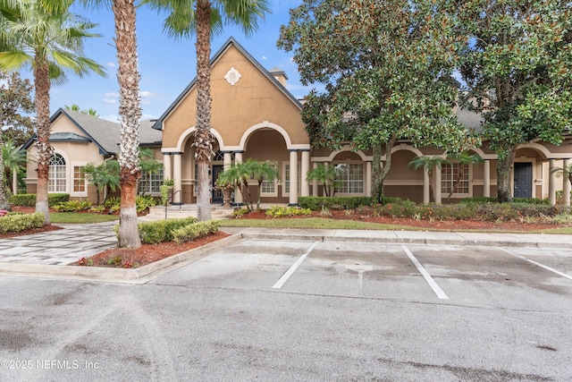 10961 Burnt Mill Rd Unit 622, Jacksonville, FL 32256 - view of building exterior with uncovered parking