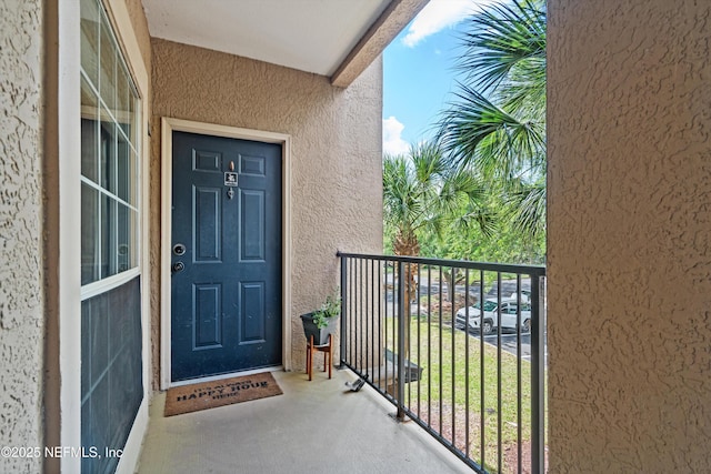 10961 Burnt Mill Rd Unit 622, Jacksonville, FL 32256 - entrance to property featuring a balcony and stucco siding