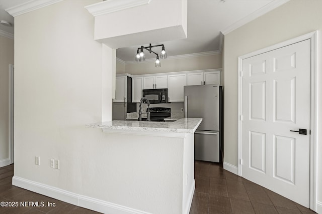10961 Burnt Mill Rd Unit 622, Jacksonville, FL 32256 - kitchen featuring baseboards, ornamental molding, freestanding refrigerator, black microwave, and white cabinetry