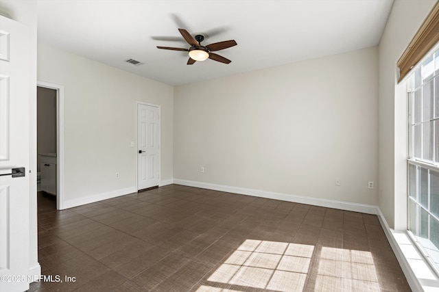 10961 Burnt Mill Rd Unit 622, Jacksonville, FL 32256 - spare room featuring visible vents, baseboards, and a ceiling fan