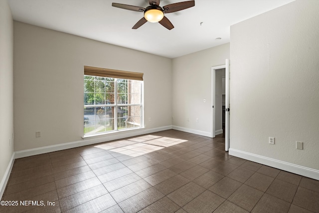 10961 Burnt Mill Rd Unit 622, Jacksonville, FL 32256 - unfurnished room with baseboards and a ceiling fan