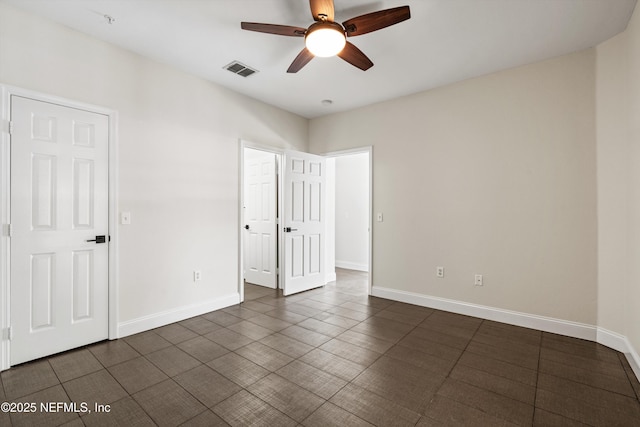 10961 Burnt Mill Rd Unit 622, Jacksonville, FL 32256 - unfurnished bedroom with visible vents, baseboards, and a ceiling fan