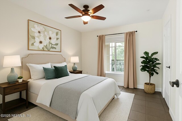 10961 Burnt Mill Rd Unit 622, Jacksonville, FL 32256 - tiled bedroom featuring ceiling fan and baseboards