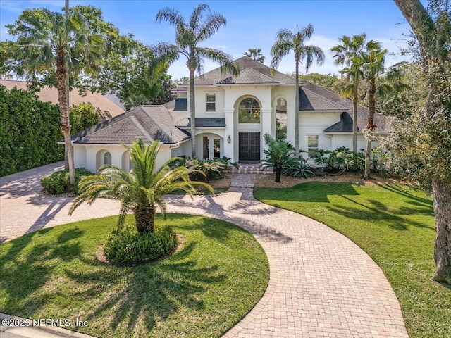 13648 Marsh Harbor Dr N, Jacksonville, FL 32225 - view of front facade featuring a front yard, curved driveway, and stucco siding