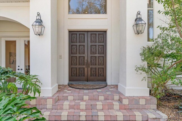13648 Marsh Harbor Dr N, Jacksonville, FL 32225 - doorway to property with stucco siding