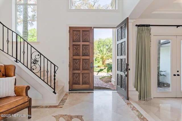 13648 Marsh Harbor Dr N, Jacksonville, FL 32225 - foyer featuring a high ceiling, marble finish floor, and stairway