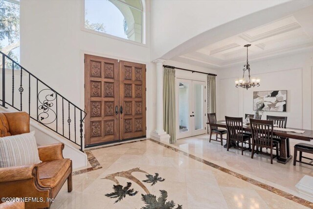 13648 Marsh Harbor Dr N, Jacksonville, FL 32225 - foyer entrance with french doors, an inviting chandelier, plenty of natural light, and stairs