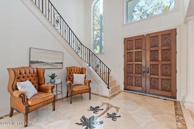 13648 Marsh Harbor Dr N, Jacksonville, FL 32225 - entrance foyer with french doors, baseboards, stairway, and a towering ceiling
