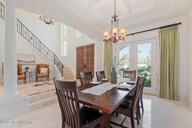 13648 Marsh Harbor Dr N, Jacksonville, FL 32225 - dining space with a chandelier, stairway, french doors, and a towering ceiling