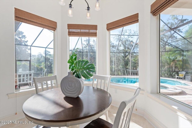 13648 Marsh Harbor Dr N, Jacksonville, FL 32225 - dining room featuring a wealth of natural light, a sunroom, baseboards, and light tile patterned flooring