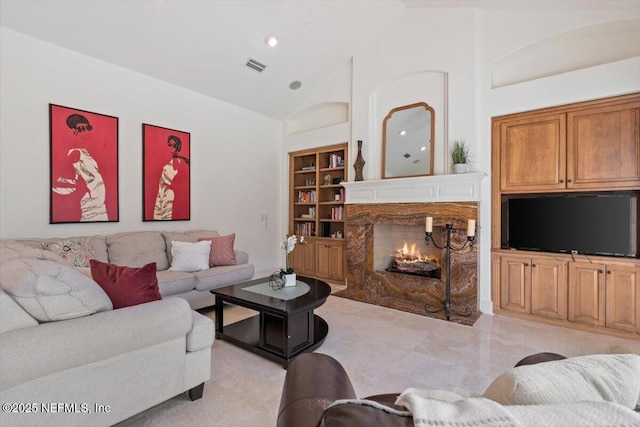 13648 Marsh Harbor Dr N, Jacksonville, FL 32225 - living area with built in features, high vaulted ceiling, visible vents, and a fireplace with flush hearth