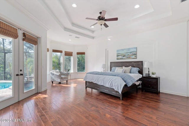 13648 Marsh Harbor Dr N, Jacksonville, FL 32225 - bedroom with french doors, a tray ceiling, access to exterior, and hardwood / wood-style flooring