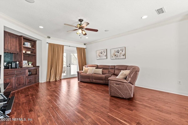 13648 Marsh Harbor Dr N, Jacksonville, FL 32225 - living room featuring french doors, crown molding, visible vents, dark wood finished floors, and ceiling fan