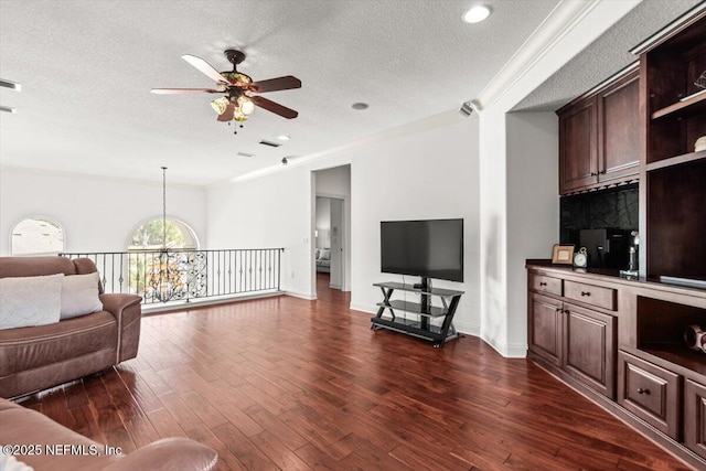 13648 Marsh Harbor Dr N, Jacksonville, FL 32225 - living room with visible vents, ornamental molding, ceiling fan, a textured ceiling, and dark wood-style floors
