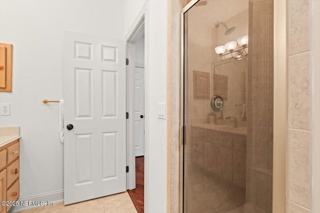 13648 Marsh Harbor Dr N, Jacksonville, FL 32225 - bathroom featuring a stall shower, vanity, baseboards, and tile patterned floors
