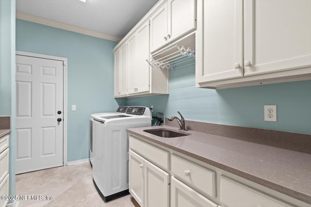 13648 Marsh Harbor Dr N, Jacksonville, FL 32225 - clothes washing area with washing machine and dryer, a sink, ornamental molding, and cabinet space